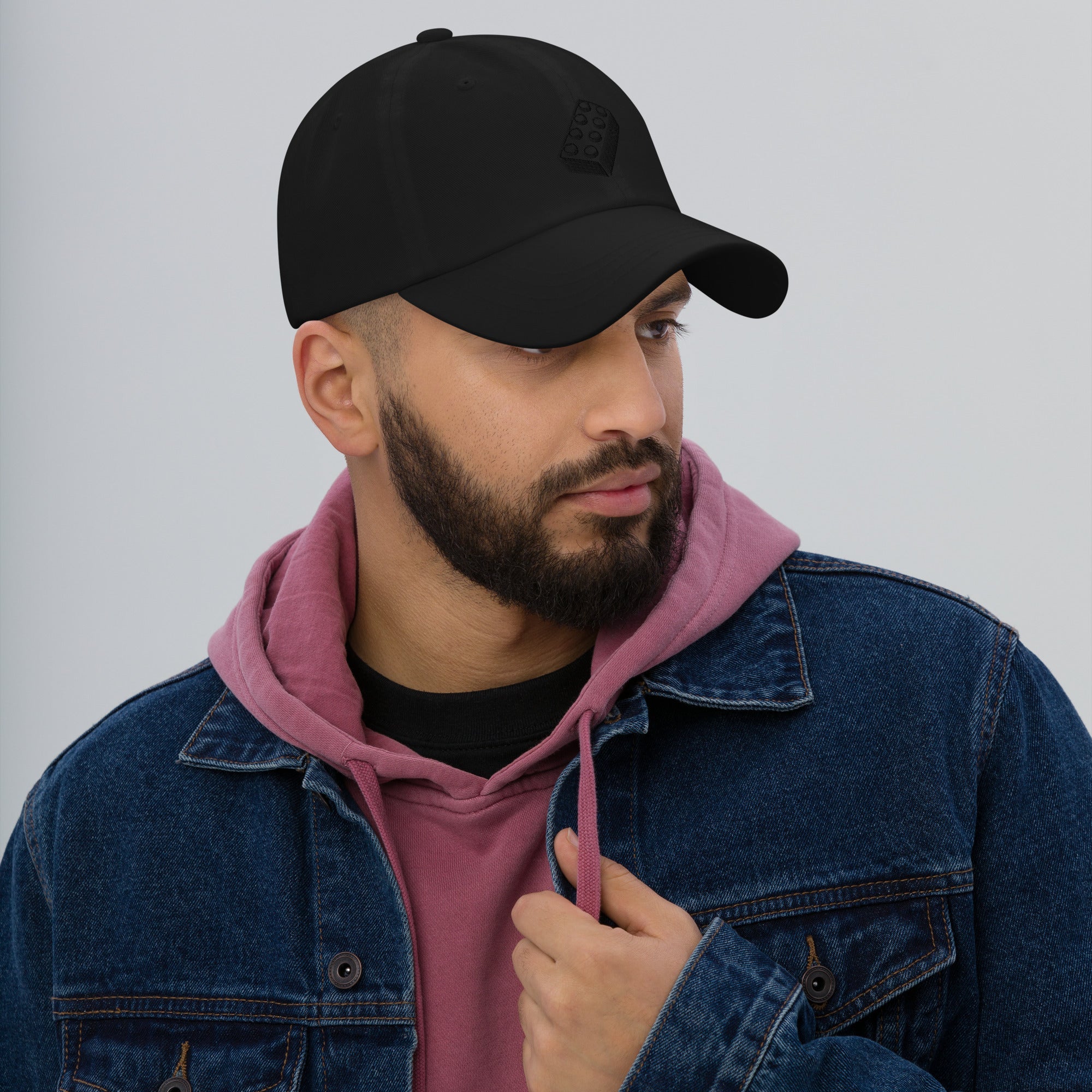 male model wearing black lego brick dad hat